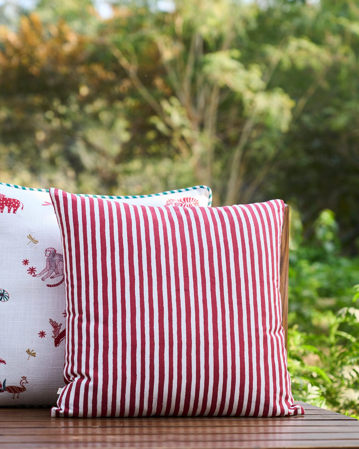Back of Golden Palm Cushion Cover in red and white stripes.