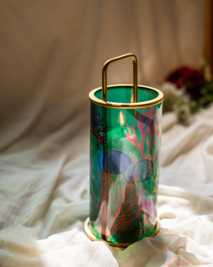 Coral Lantern with green glass, red coral print and a brass handle.