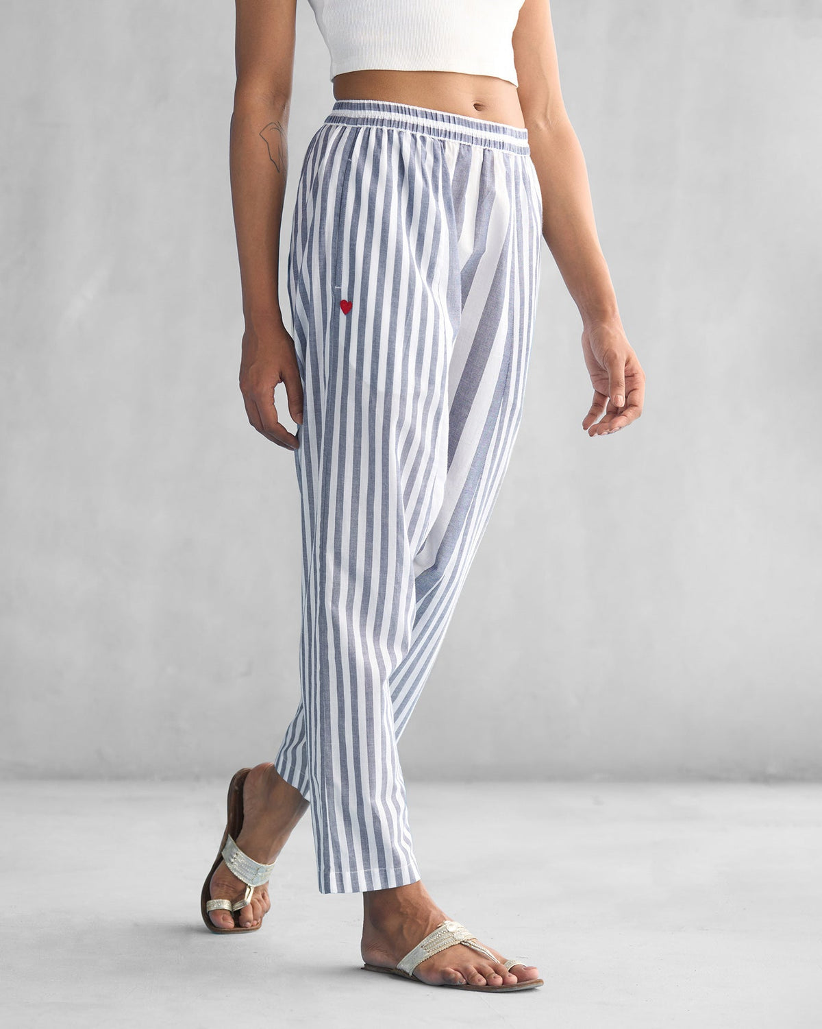 Side view of Toddy Panelled Pants in blue and white stripes.