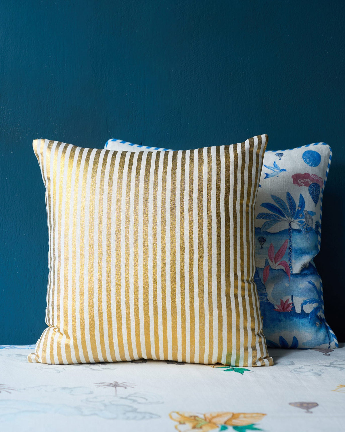 White Golden Palm cushion cover with vertical gold metallic stripes.