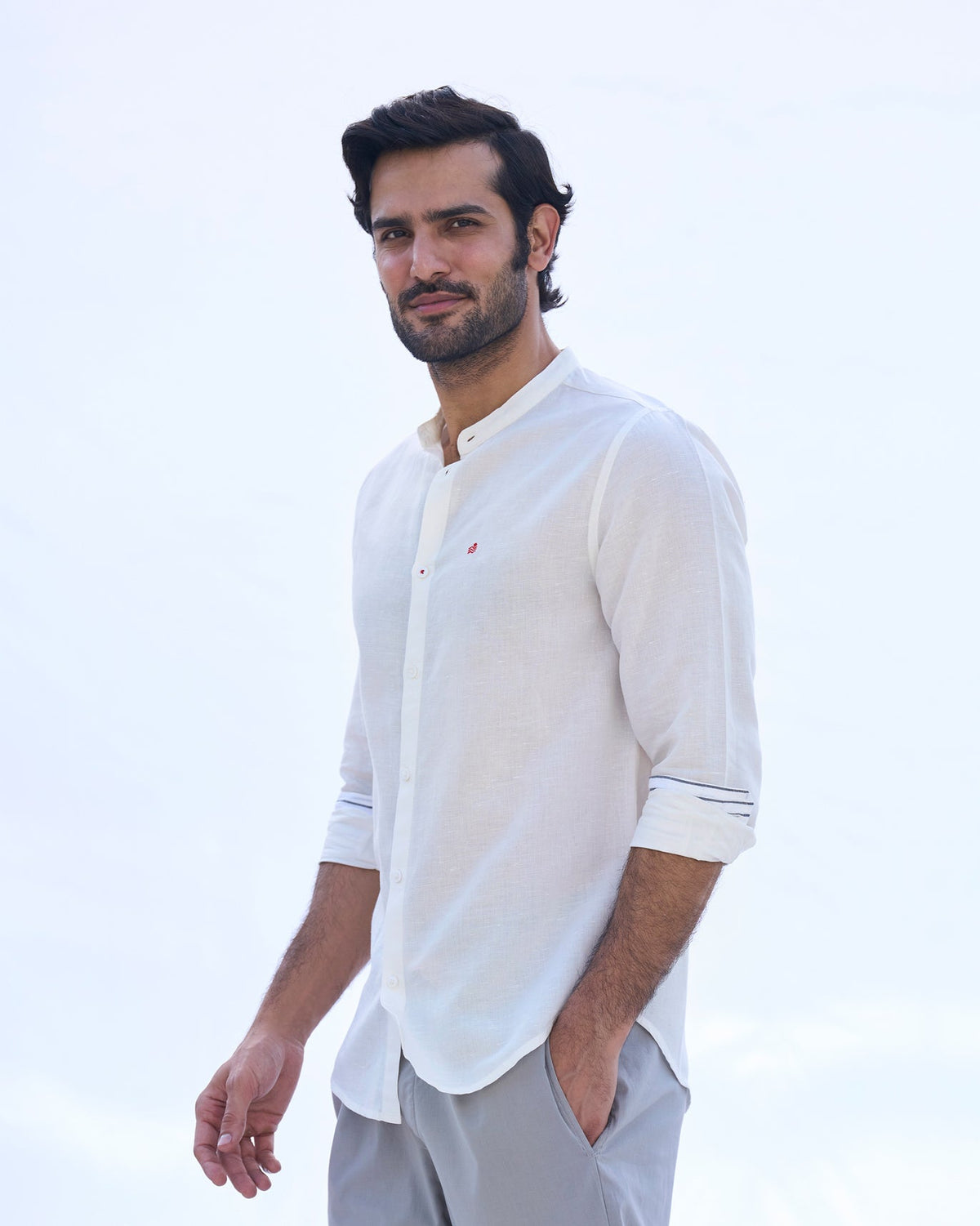 Side view of an ivory Nawab shirt worn by a person.