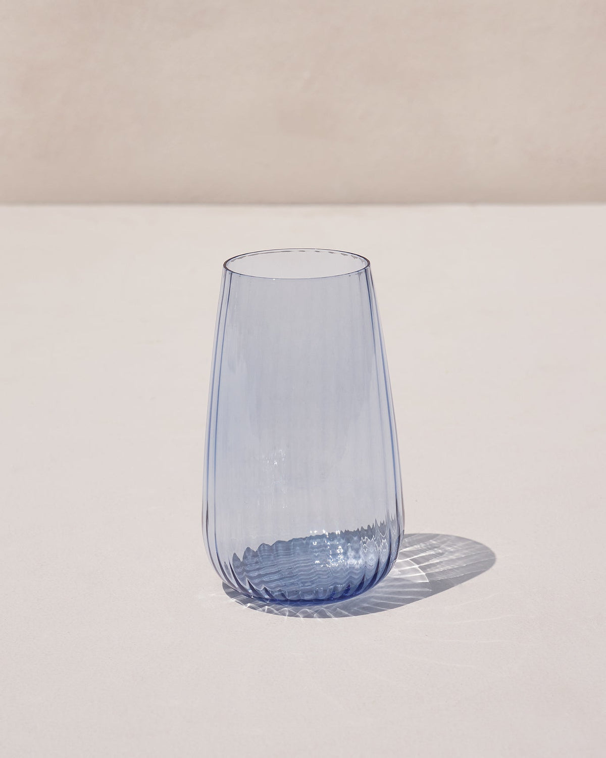 Harmony Highball Glass in blue, seen at a slight angle.