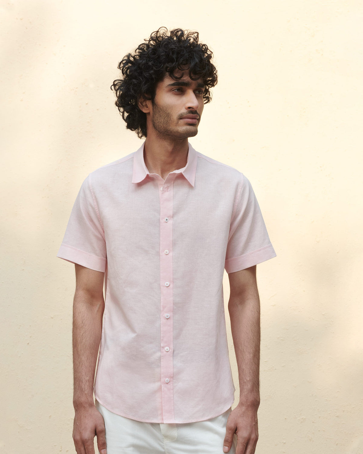 Person wearing a pink Half Sleeve Shirt.