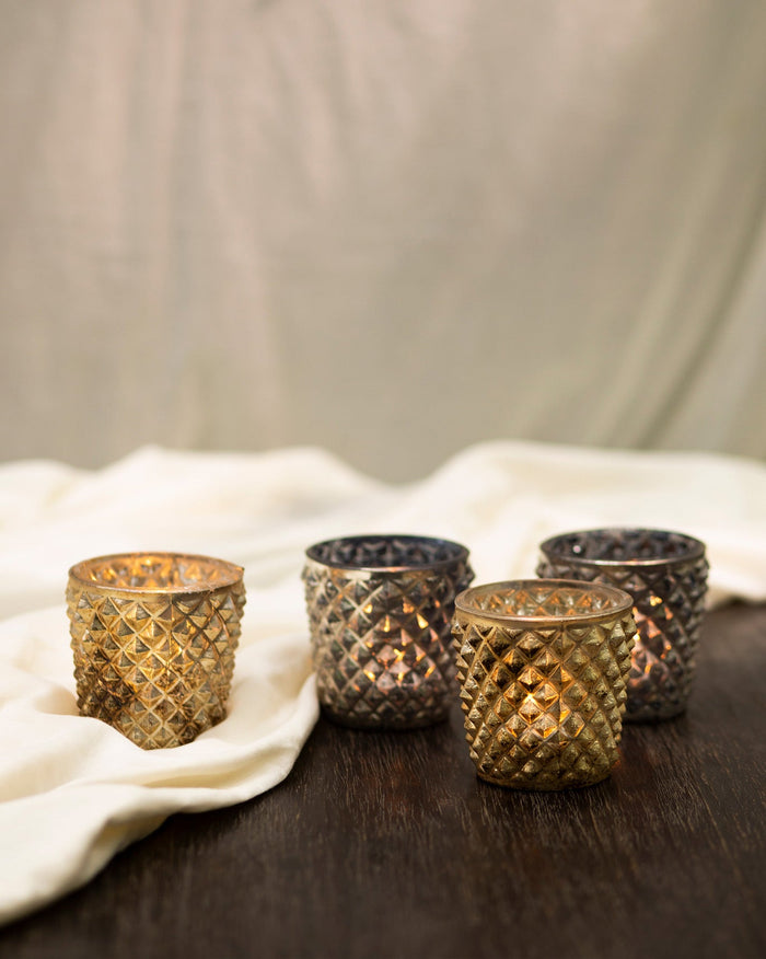Set of four Charcoal and Gold Votives with a faceted diamond pattern.
