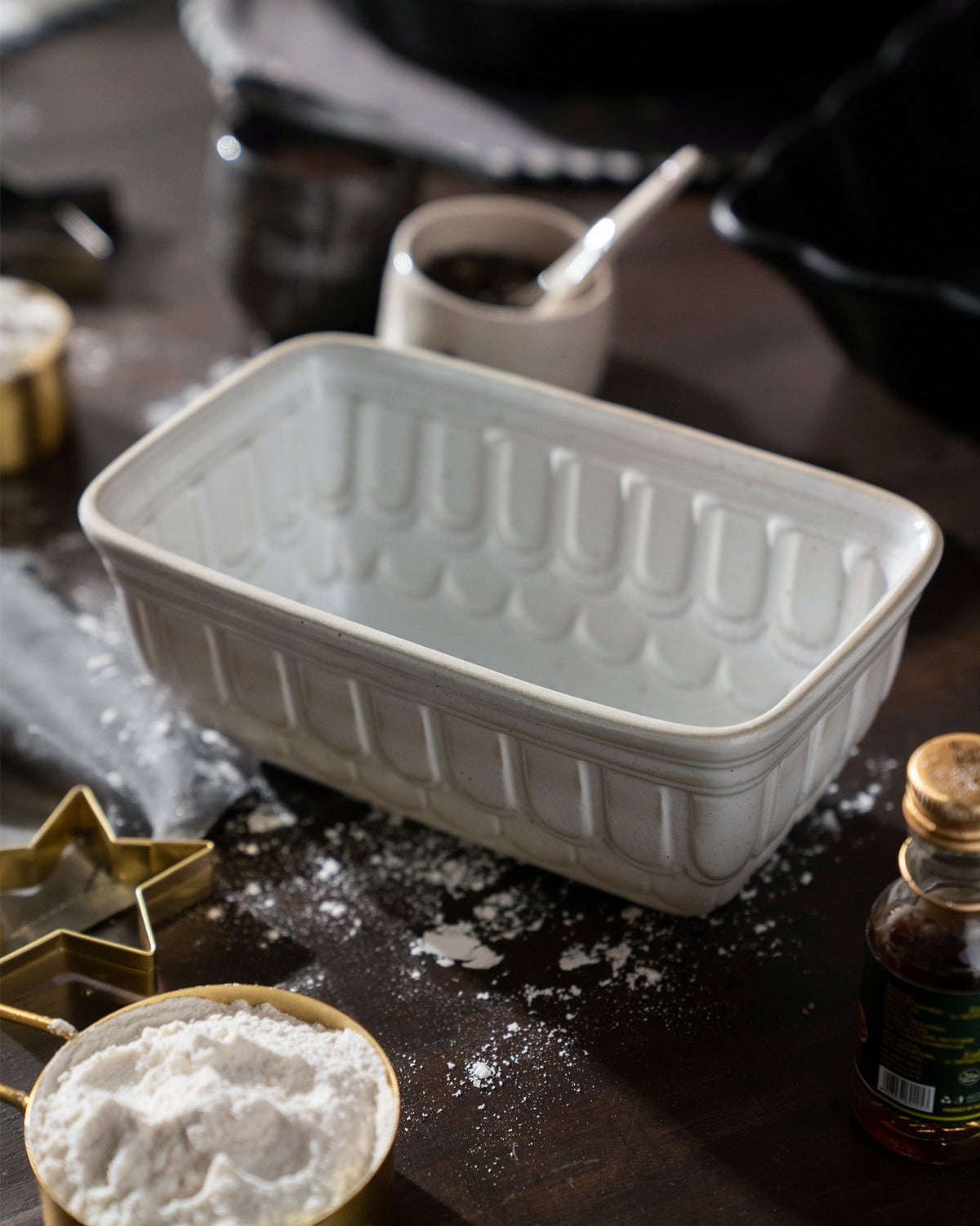 Dawn Loaf Pan on a dark table dusted with flour.
