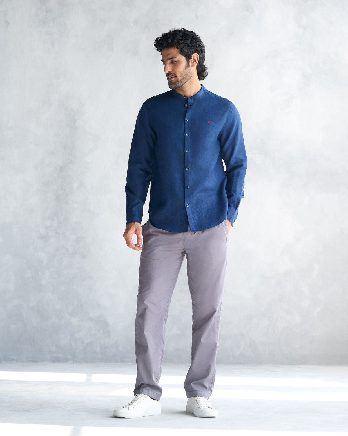 Full-length view of a navy Nawab shirt worn by a person.