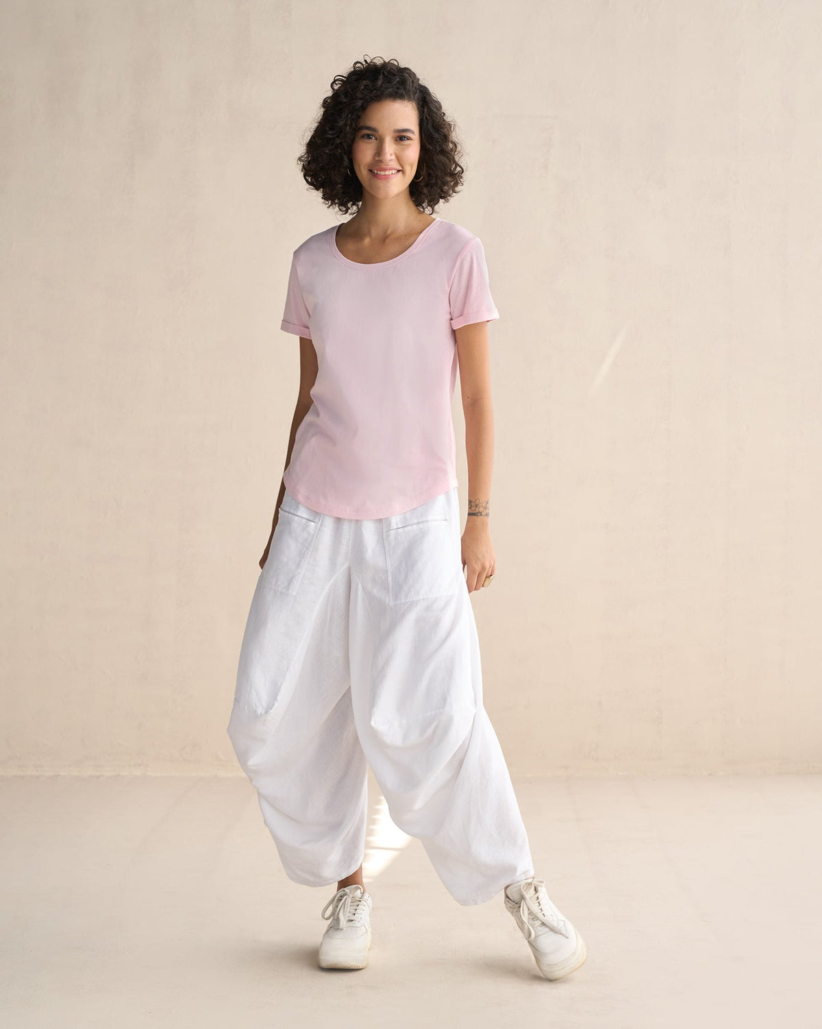 Full-length view of pink Basic T-Shirt worn by a person.