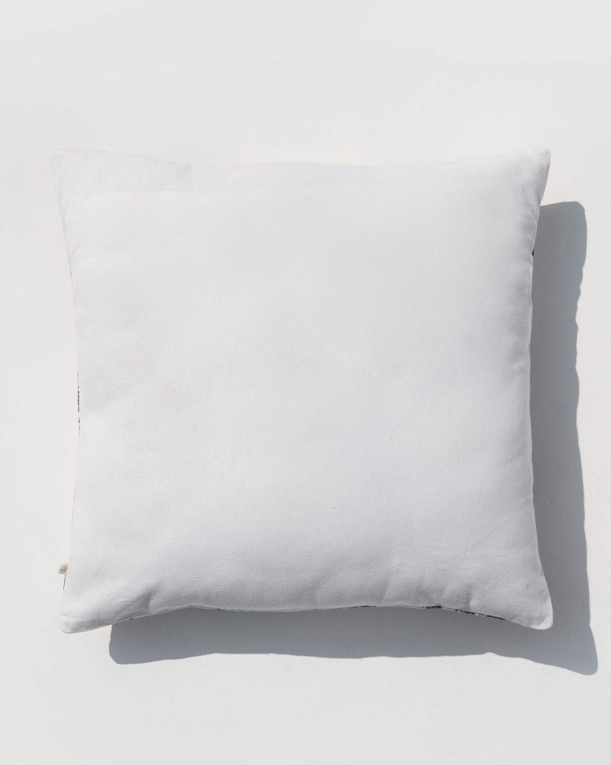 Back of a Bentota Cushion Cover in plain white.