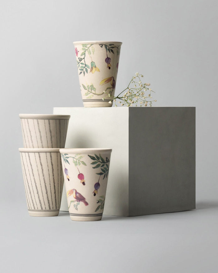 Nakano kulhar set with toucan print and grey pinstripe designs.