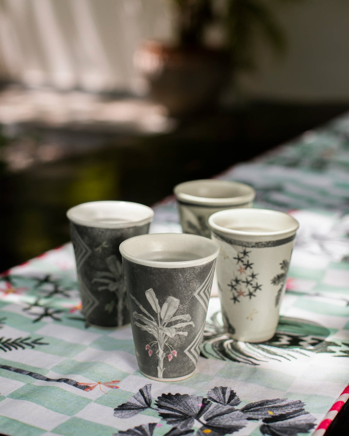 Periyar Kulhars cups grouped together in grey and cream designs.