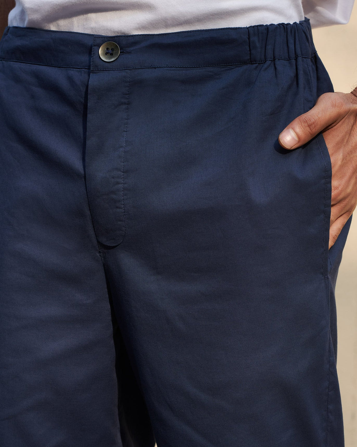 Close-up of navy Shillong Jammies showing the elastic waistband and button closure.