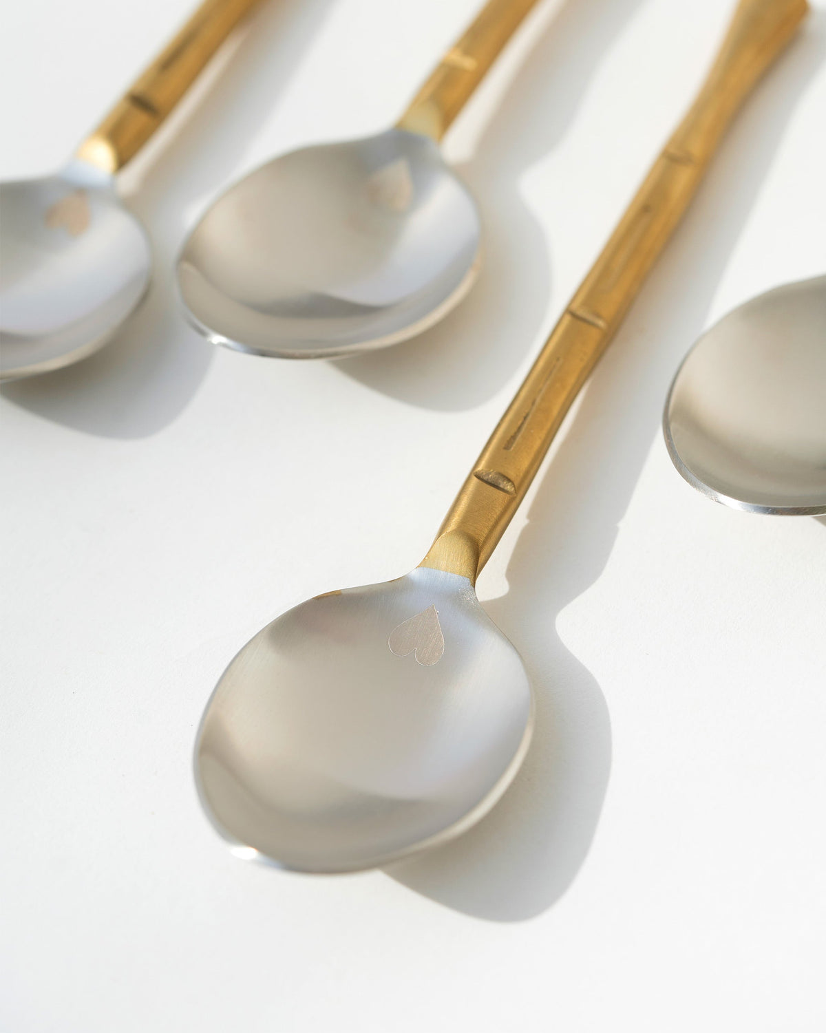 Close-up of Horizon Spoon (Set of 4) showing polished silver bowls.