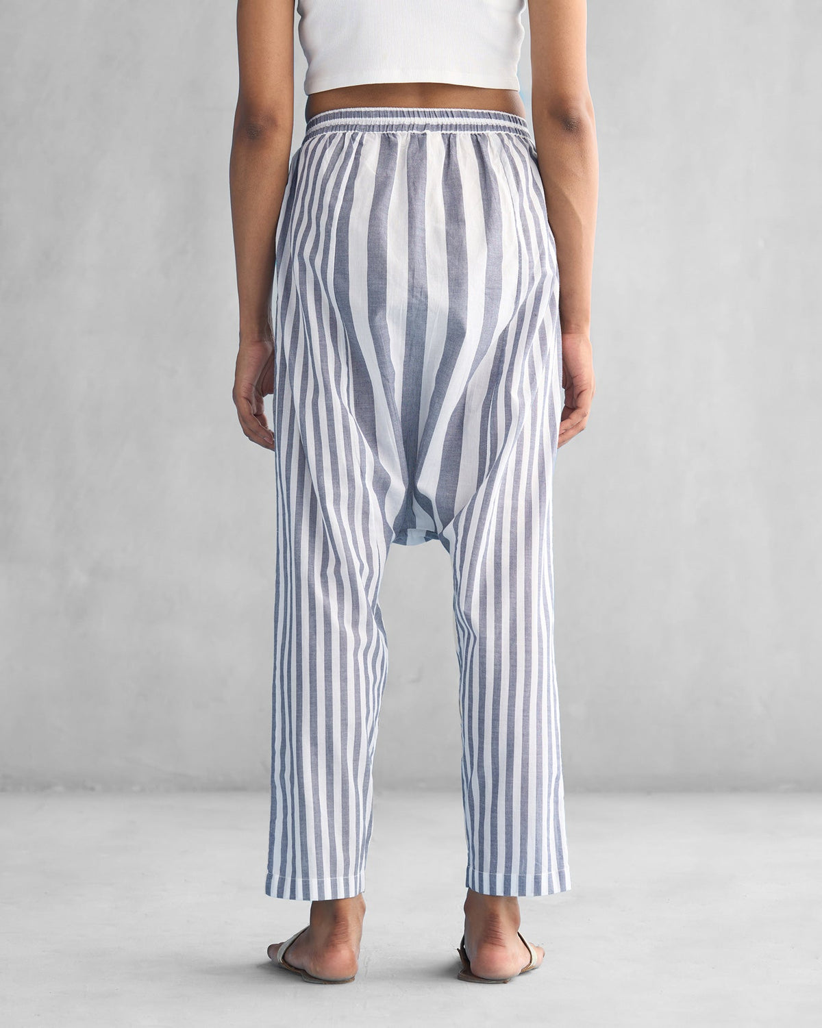 Back of Toddy Panelled Pants in blue and white stripes worn by a person.