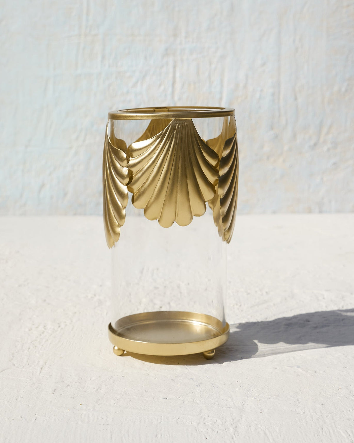 Shell Hurricane standing upright on a white surface, its glass body visible.