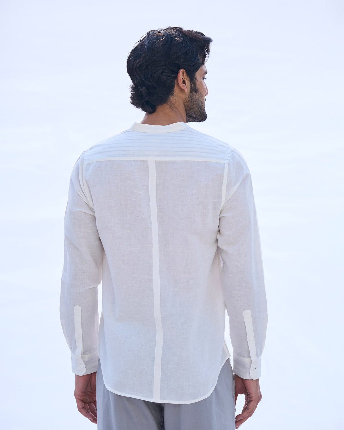 Back of an ivory Nawab shirt worn by a person.