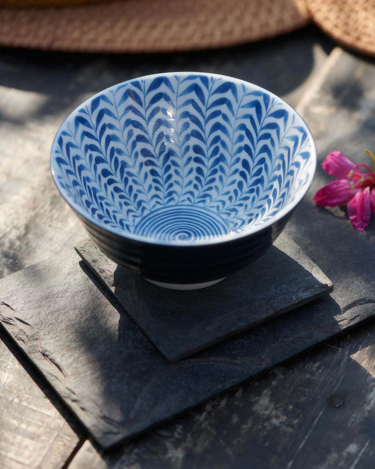 Angled view from above of Aiiro Rice Bowl with its blue chevron interior.