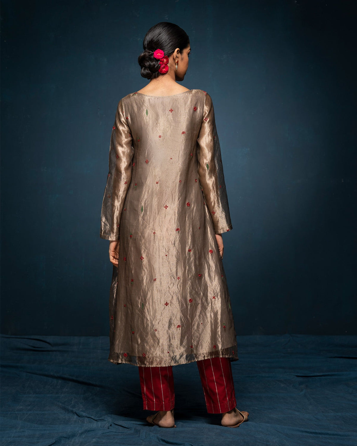 Back of a gold Boat Neck Kurta worn by a person.