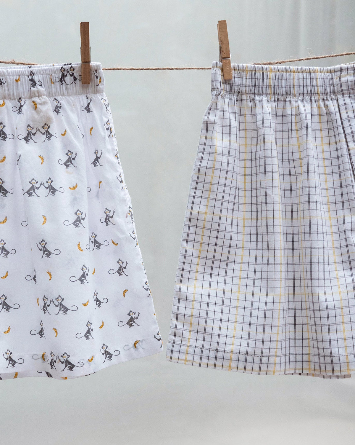 Going Bananas Boxers hanging on a clothesline, one monkey print and one checked.