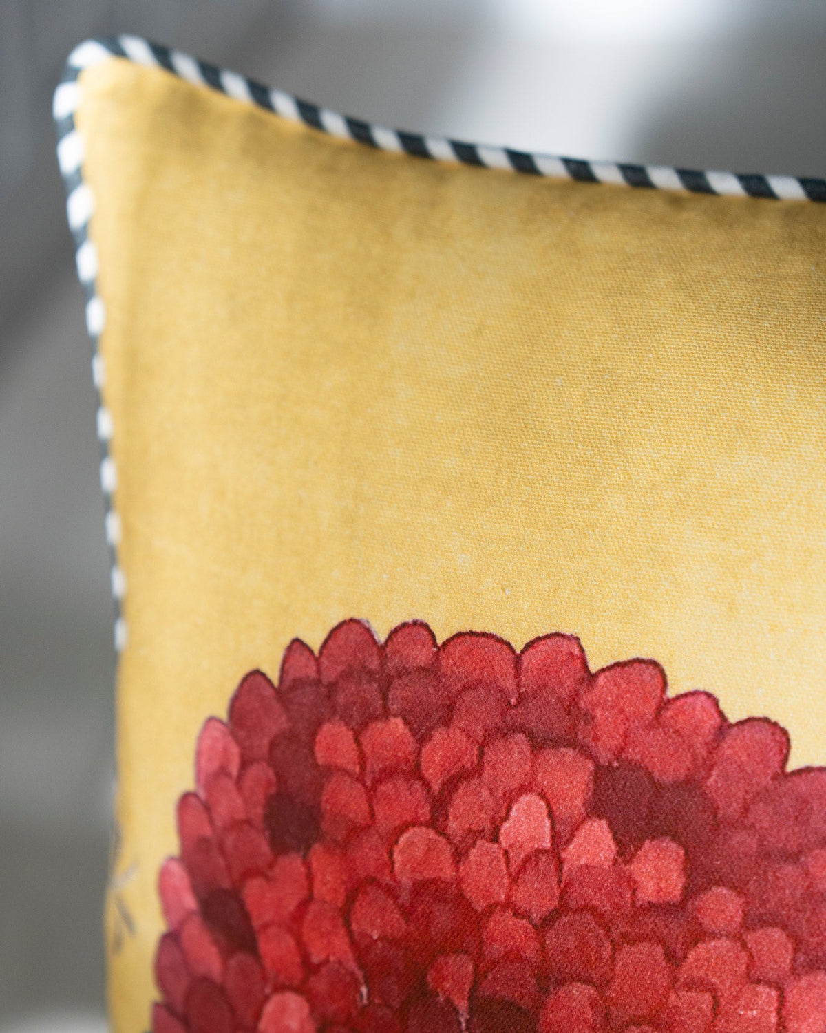 Close-up of Winter Wonderland Cushion Cover showing a red flower bloom.