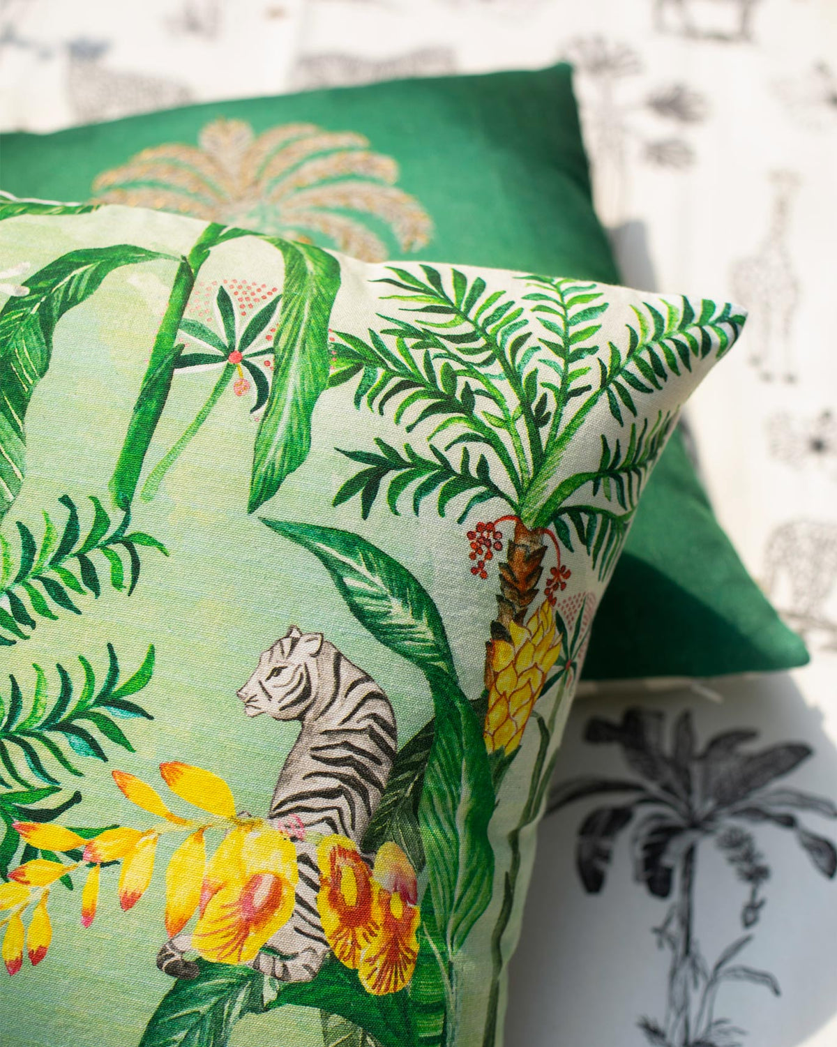 Close-up of the Idukki Cushion Cover showing a tiger among palm leaves.