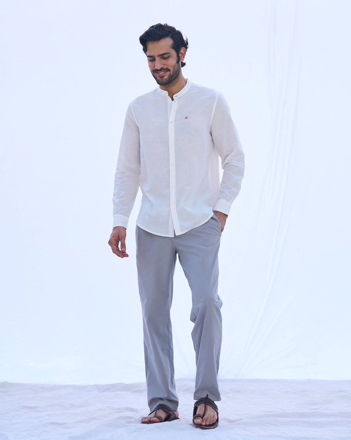 Full-length view of an ivory Nawab shirt worn by a person.