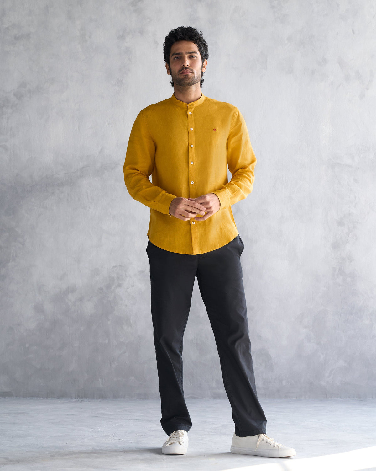 Full-length view of an ochre Nawab shirt worn by a person.