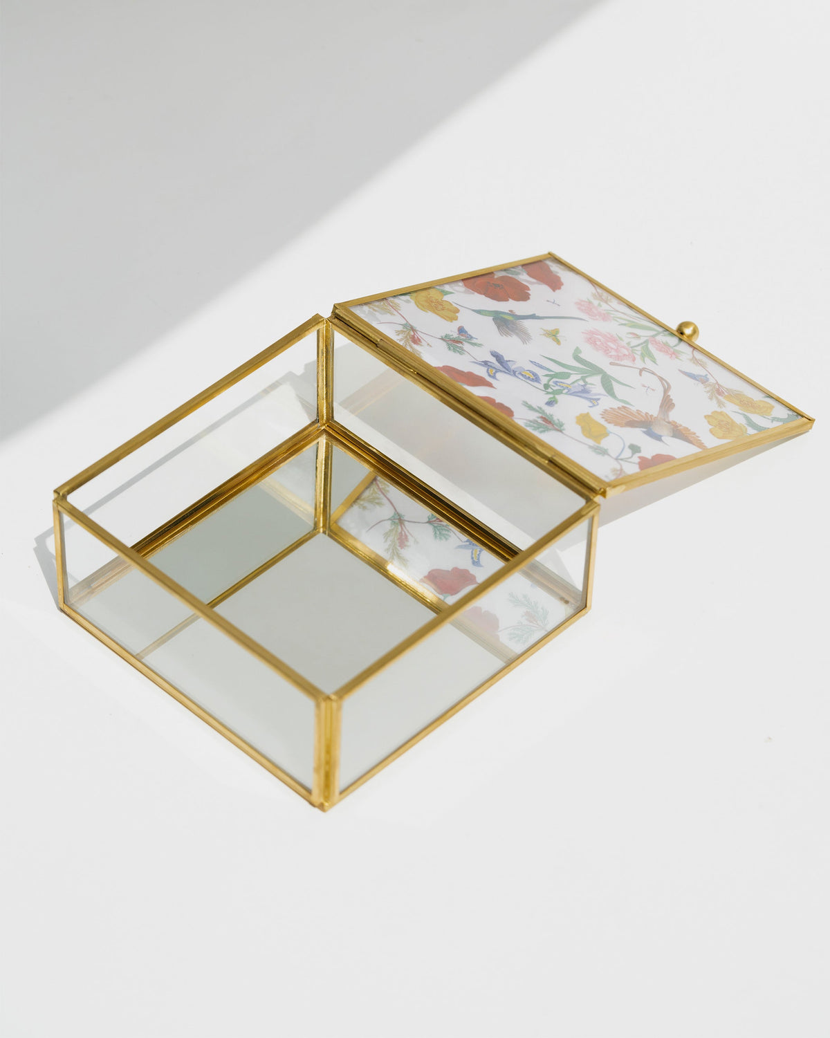 Wildflower Jewellery Box open at an angle, showing its empty glass interior.