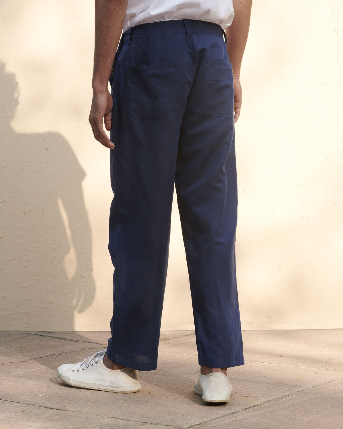Back of navy Safari Pants worn by a person.