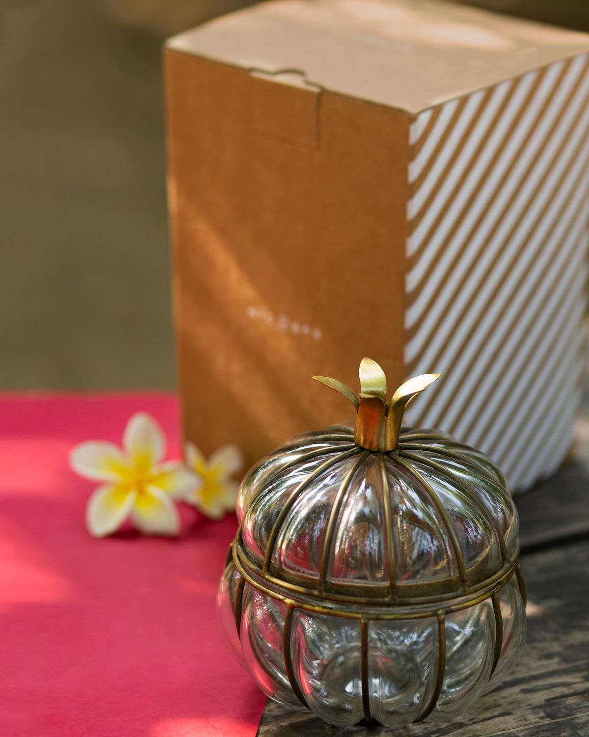 Anar Deco Jar with a brass leaf lid, shown straight on.