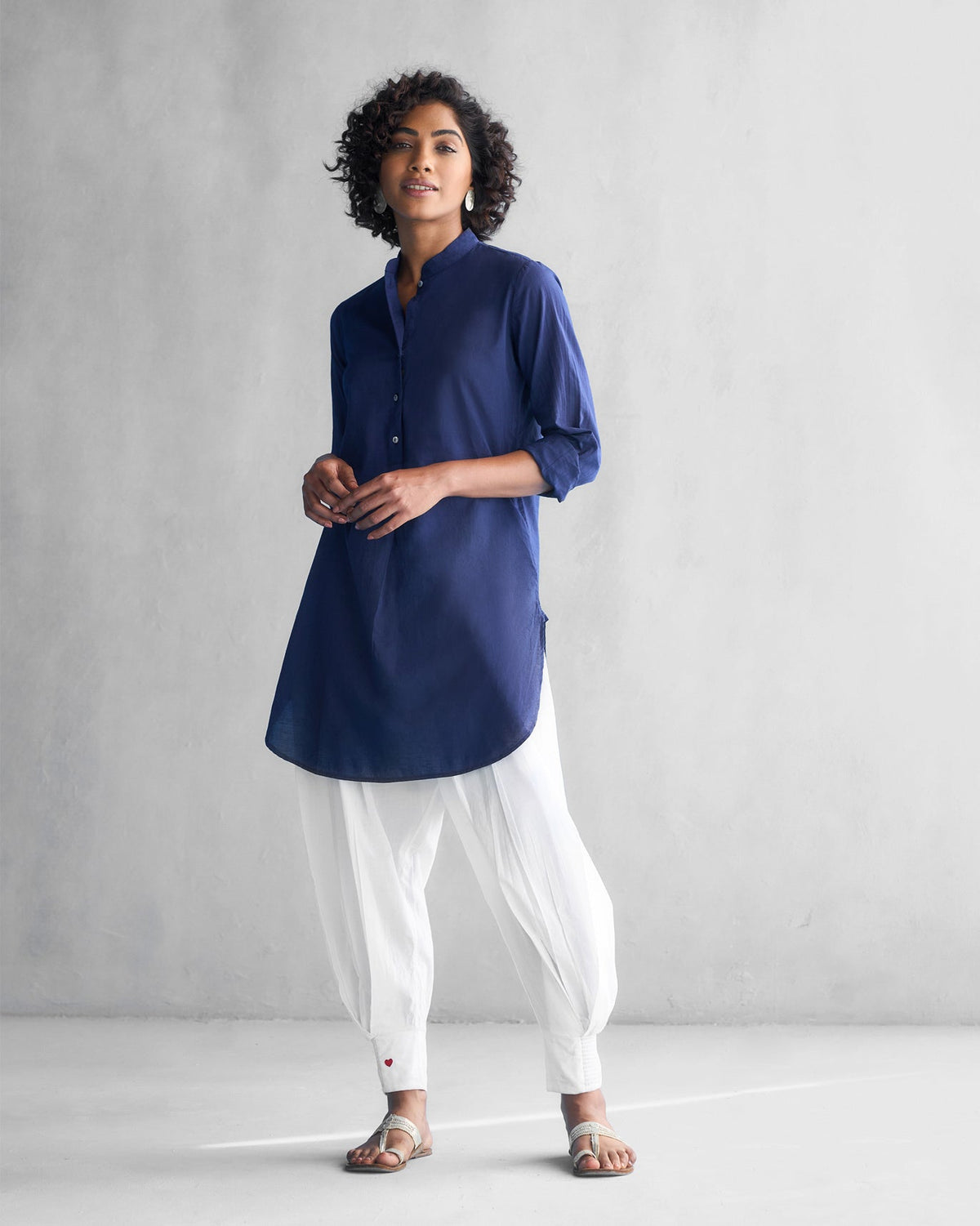Person wearing a blue Basic Mid Length Kurta, standing full length.
