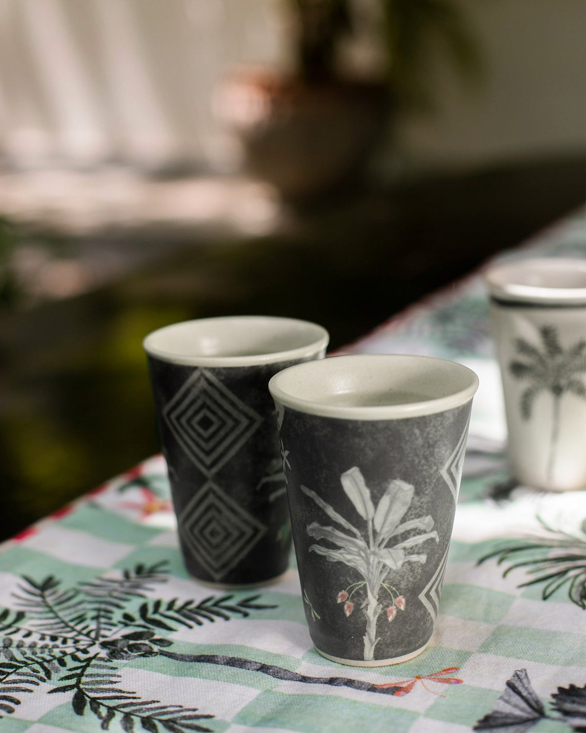 Periyar Kulhars with a palm leaf motif and a diamond pattern.