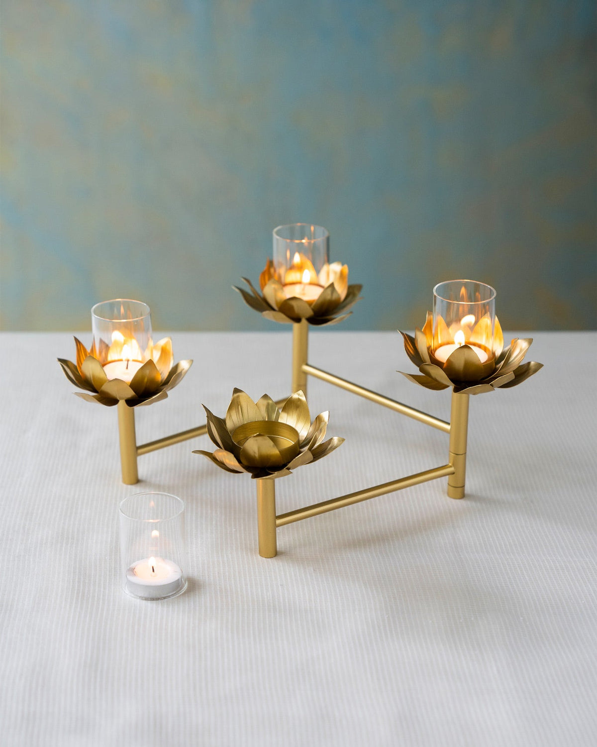 Sitara tealight stand seen from a slight angle on a white table.