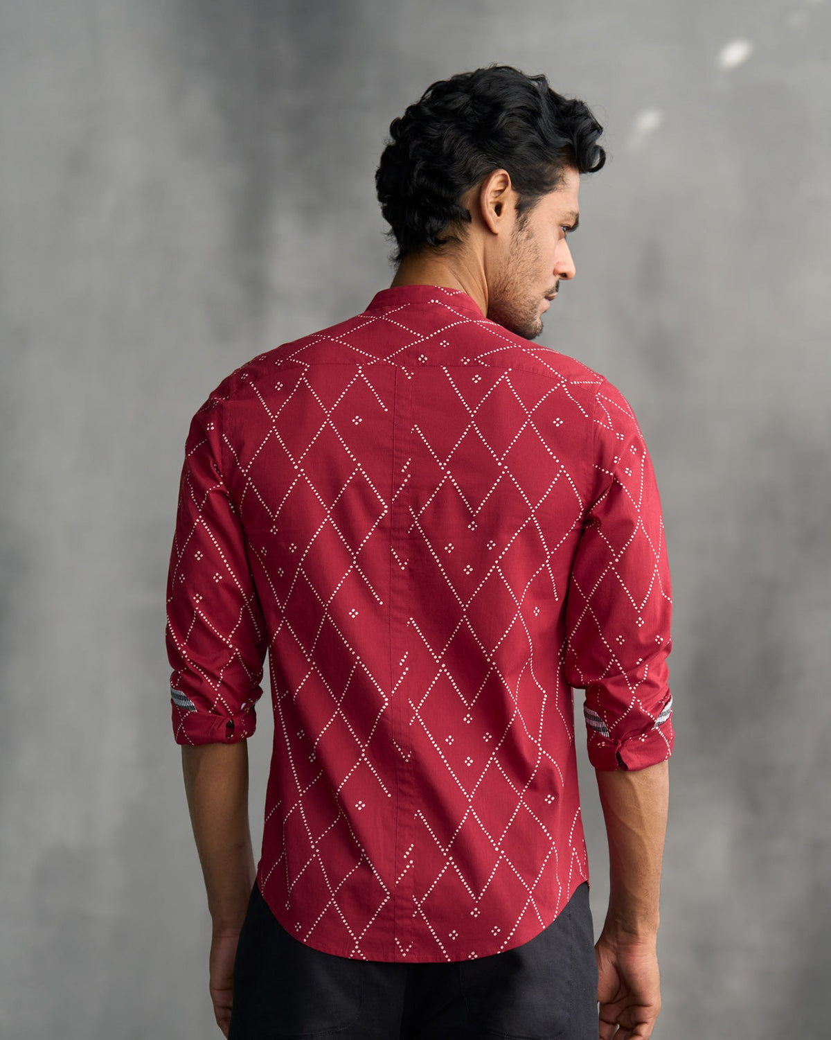 Back of a red Nawab shirt worn by a person.
