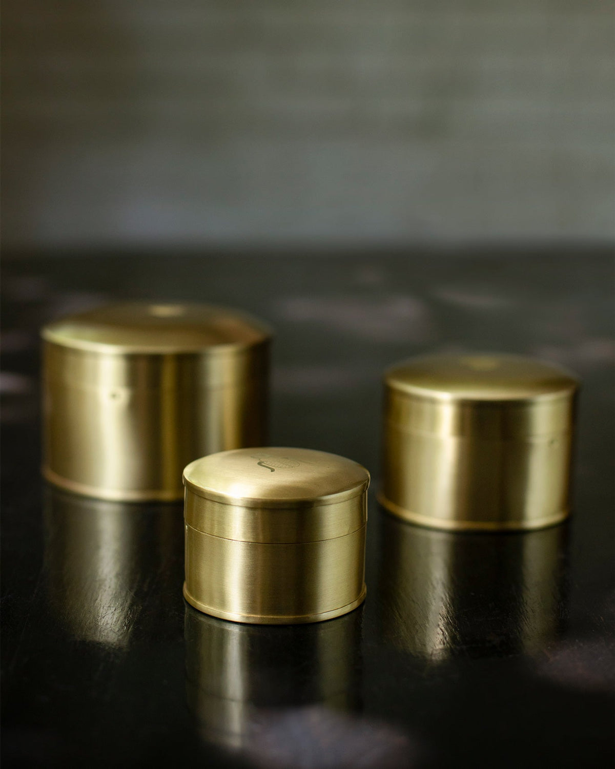 Three Dariya Nested Containers in brass, in different sizes with closed lids.