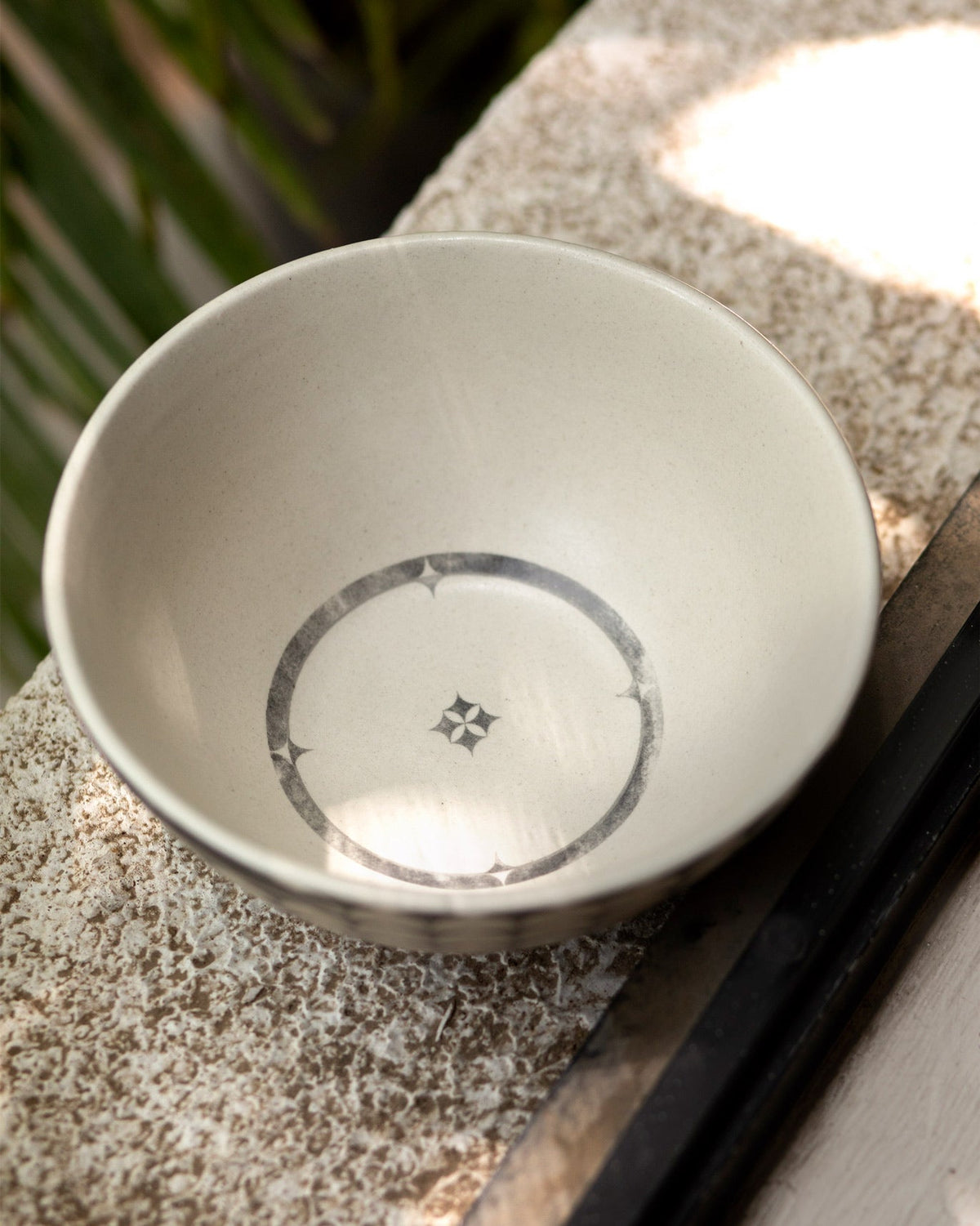 Inside of the Aasma Curry Bowl showing a grey star medallion ring.