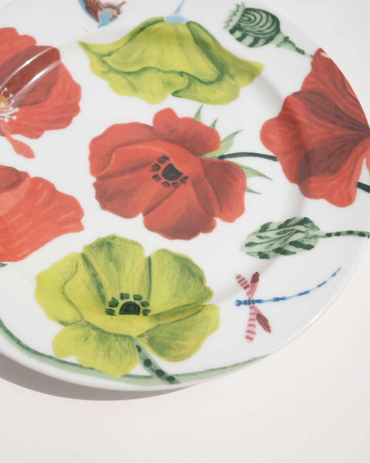Close-up of the Wildflower Quarter Plate showing poppies and a dragonfly.