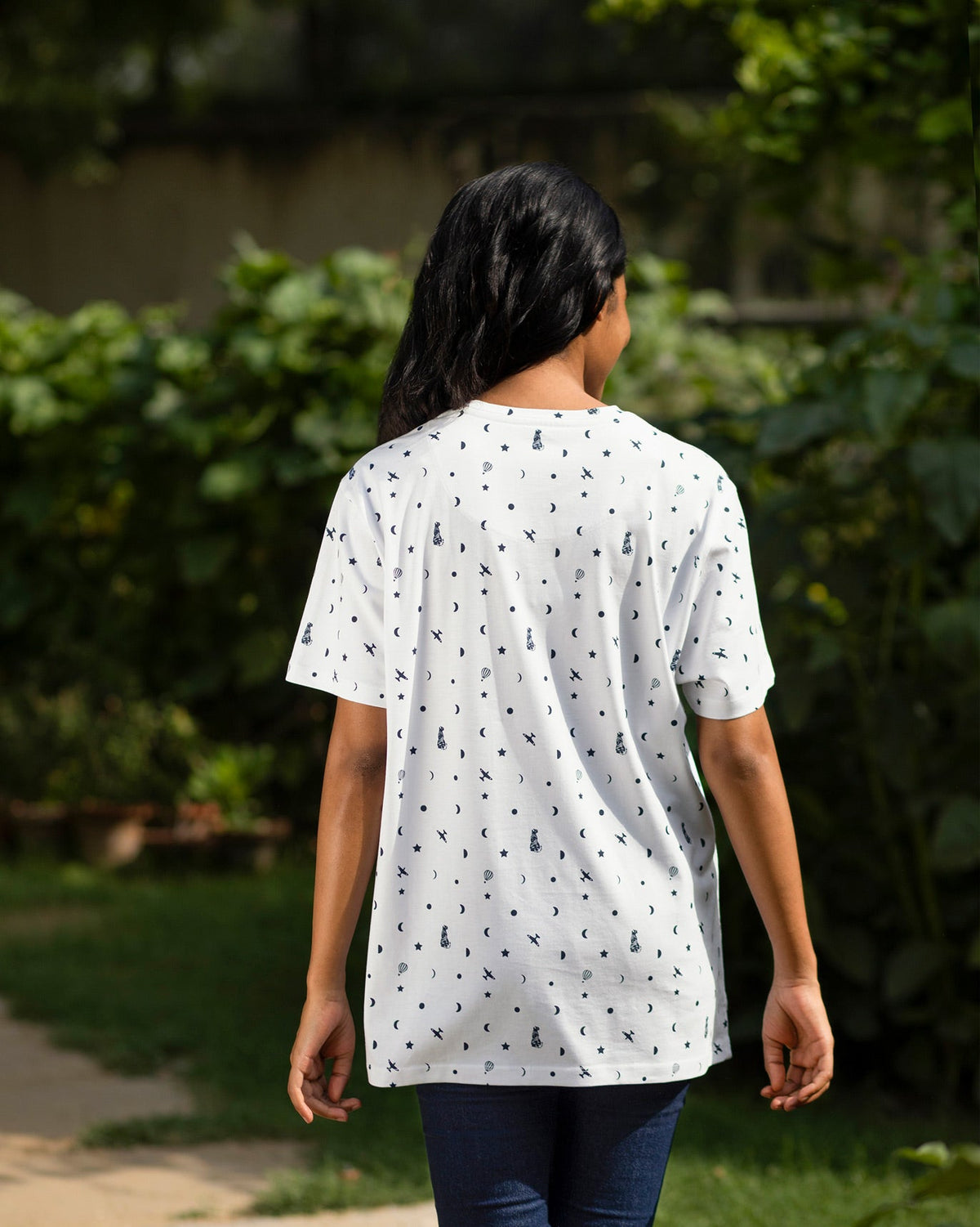 Back of a white Up and Away T-Shirt worn by a person.