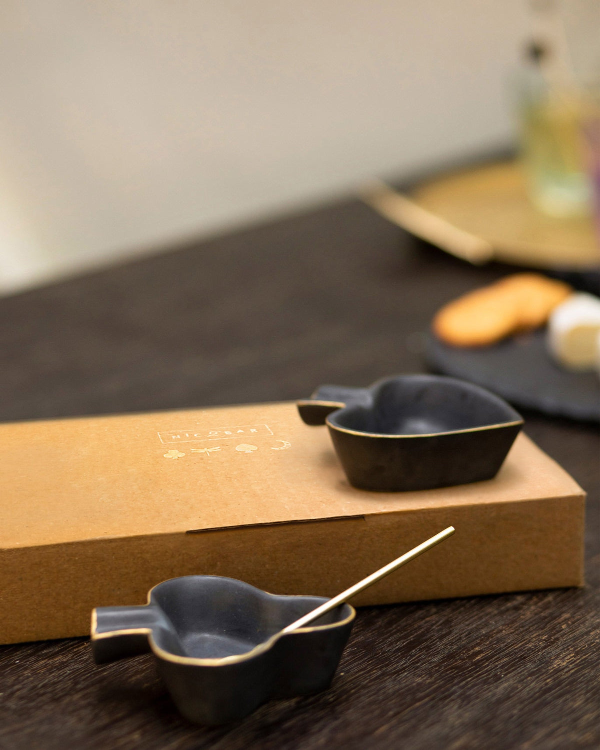 Club & Spade Trinket Dishes resting on their kraft box.