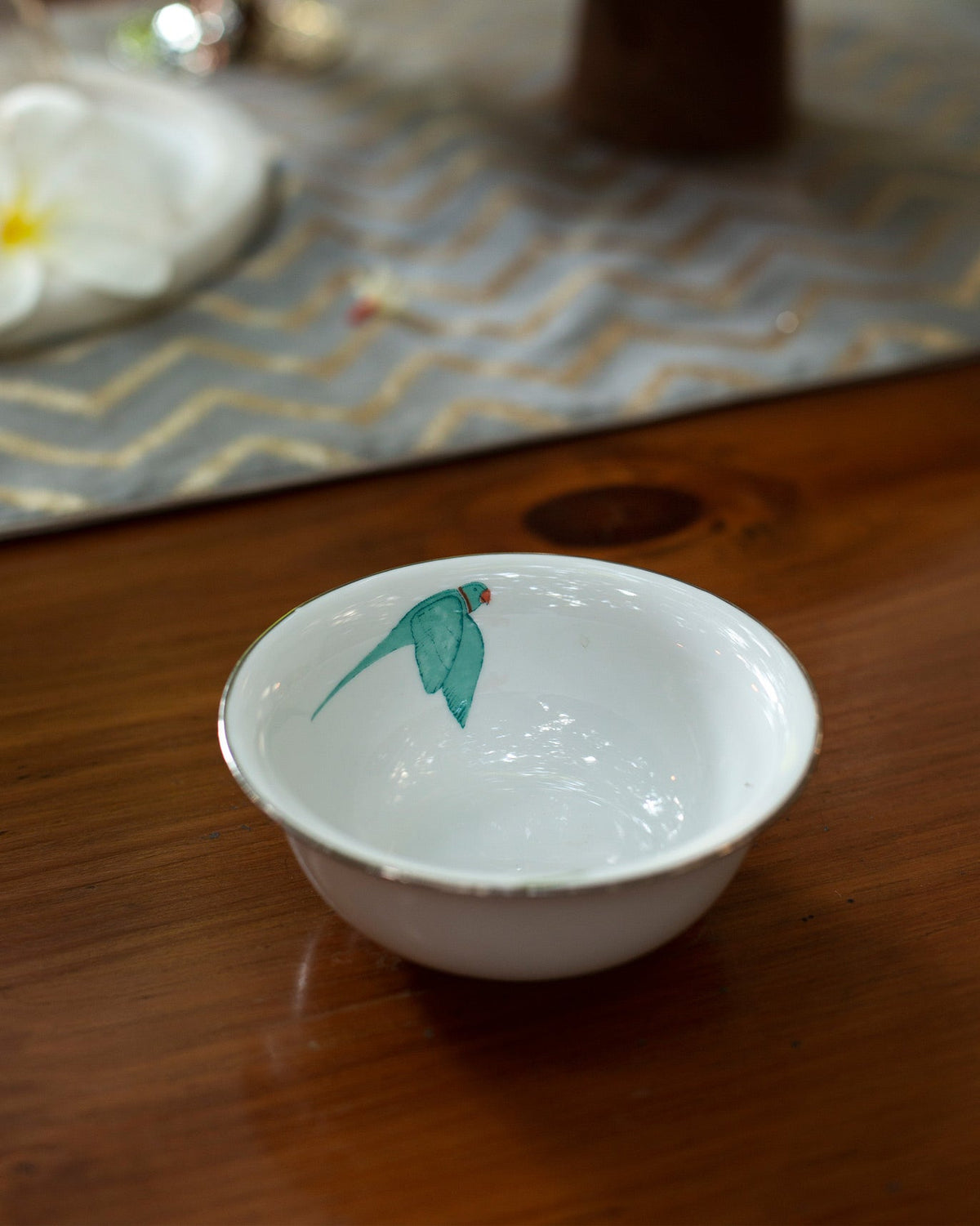 Botanical Katori with a green bird painted on the inside.