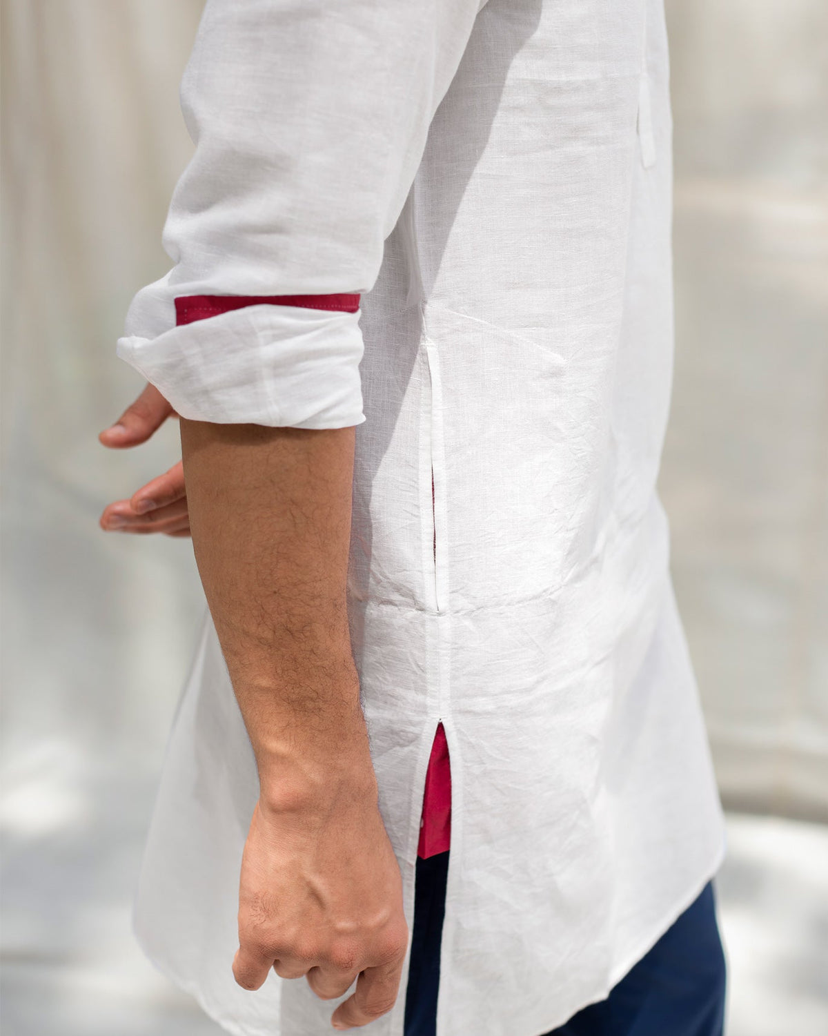 Side view of the Pondicherry Kurta showing red lining at the cuff.