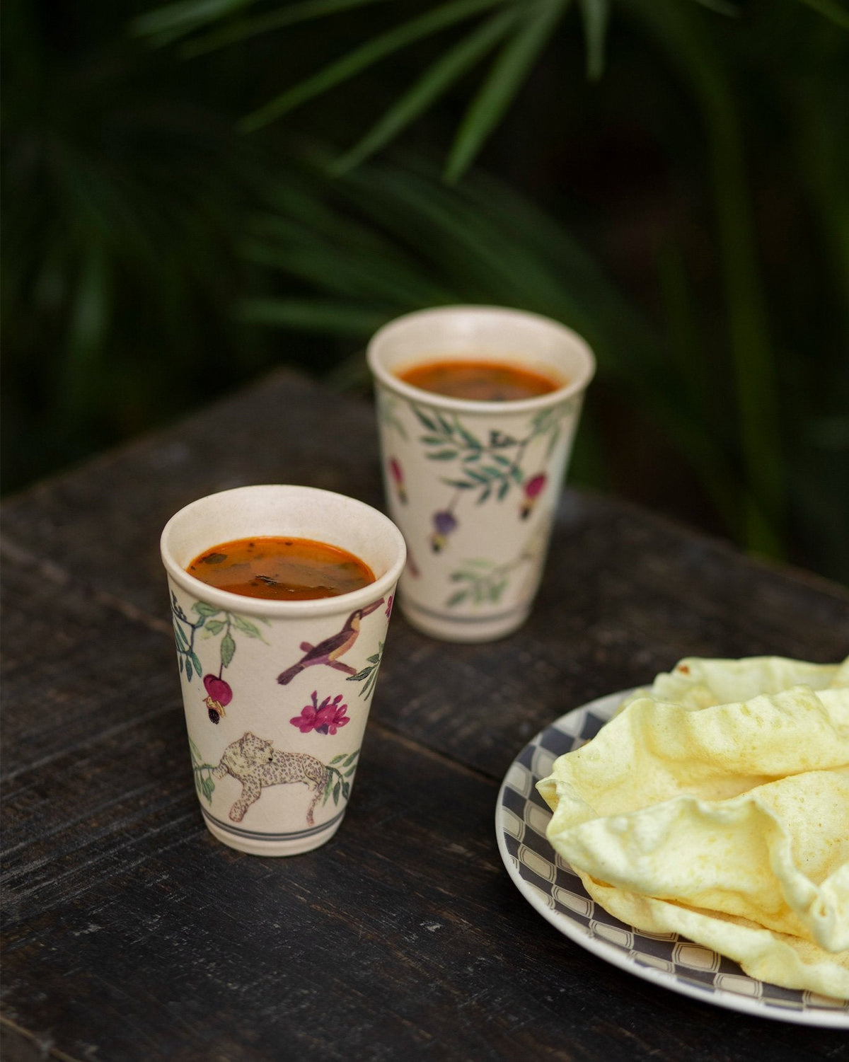 Nakano kulhars with leopard and bird print filled for an outdoor drink.