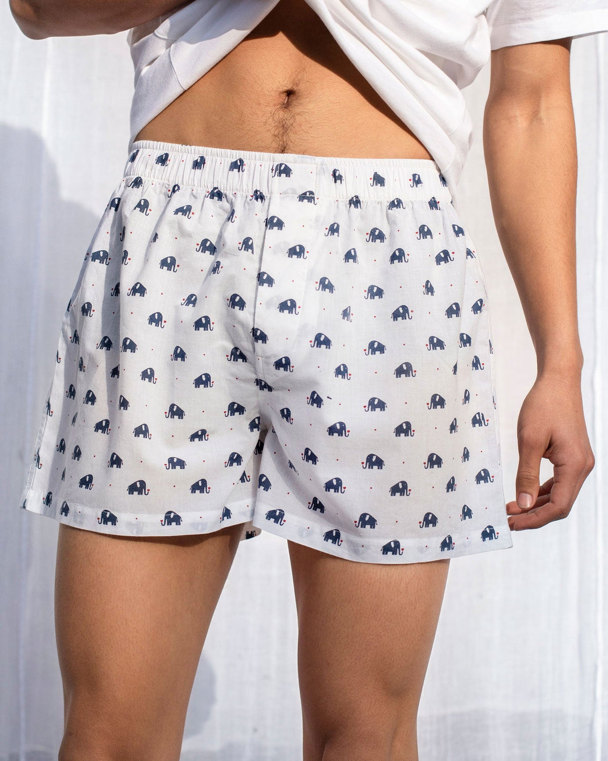 Front of navy Haathi Boxers with an elephant print worn by a person.