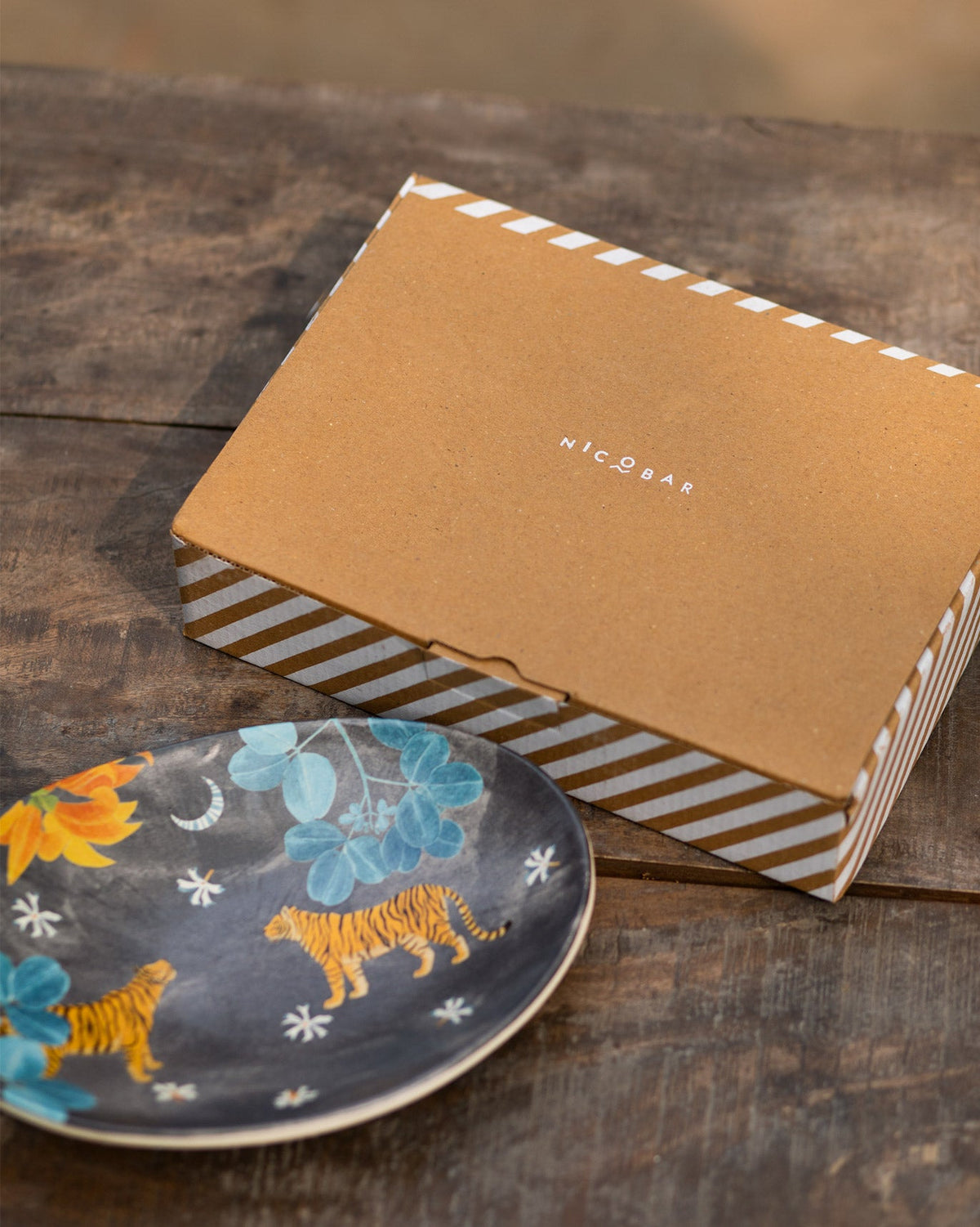 Nadi Oval Platter beside a Nicobar gift box.