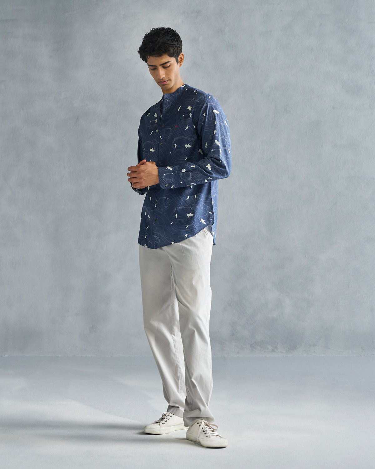 Person wearing a deep navy Nawab shirt, shown head to toe.