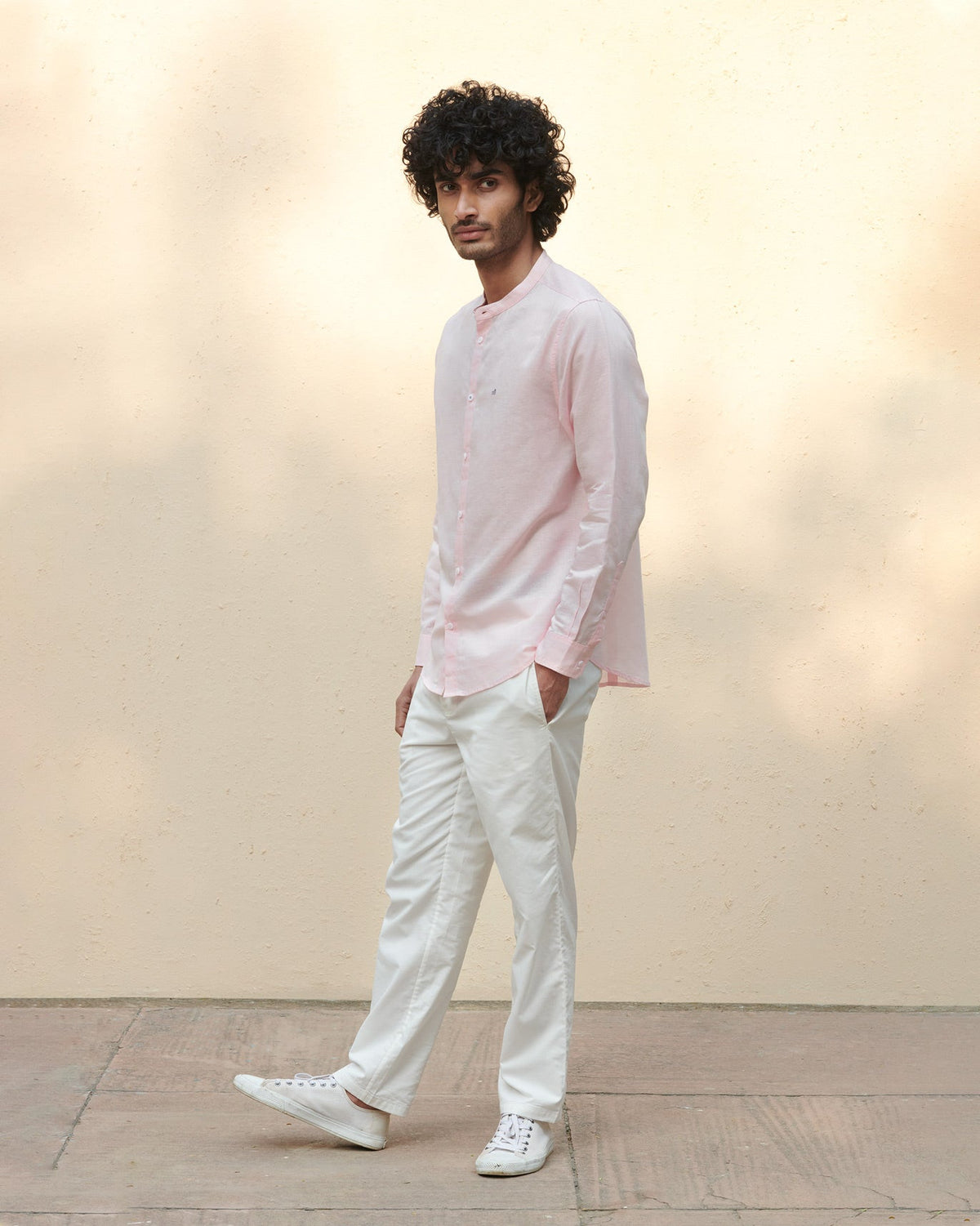 Full-length view of a pink Nawab shirt worn by a person.