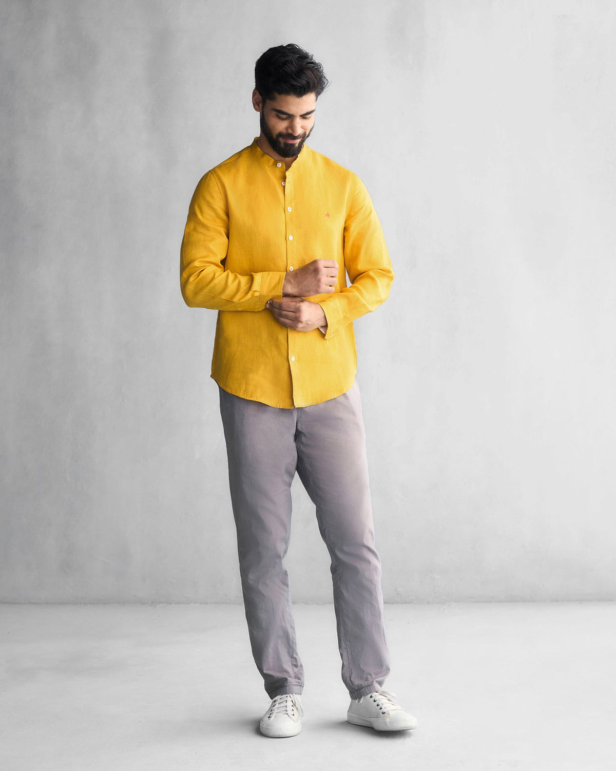 Person wearing an ochre Nawab shirt, shown head to toe.