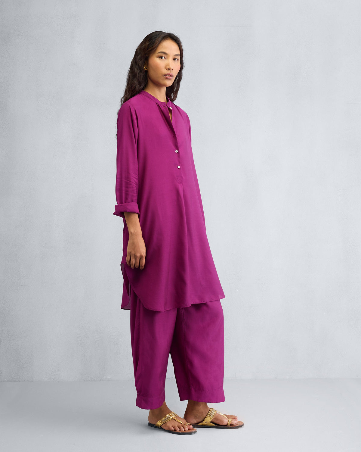 Side view of a mulberry mid-length kurta set showing the side slits.