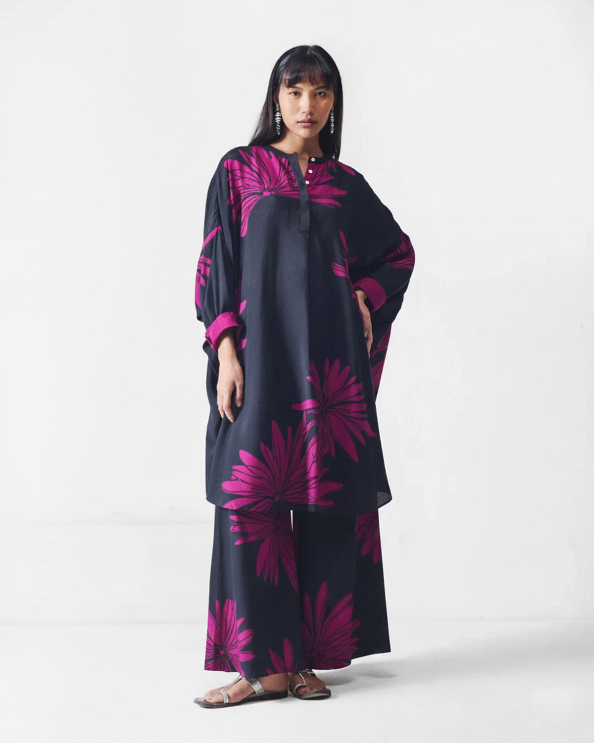 Person wearing black and mulberry printed Basic pyjamas with a matching tunic.