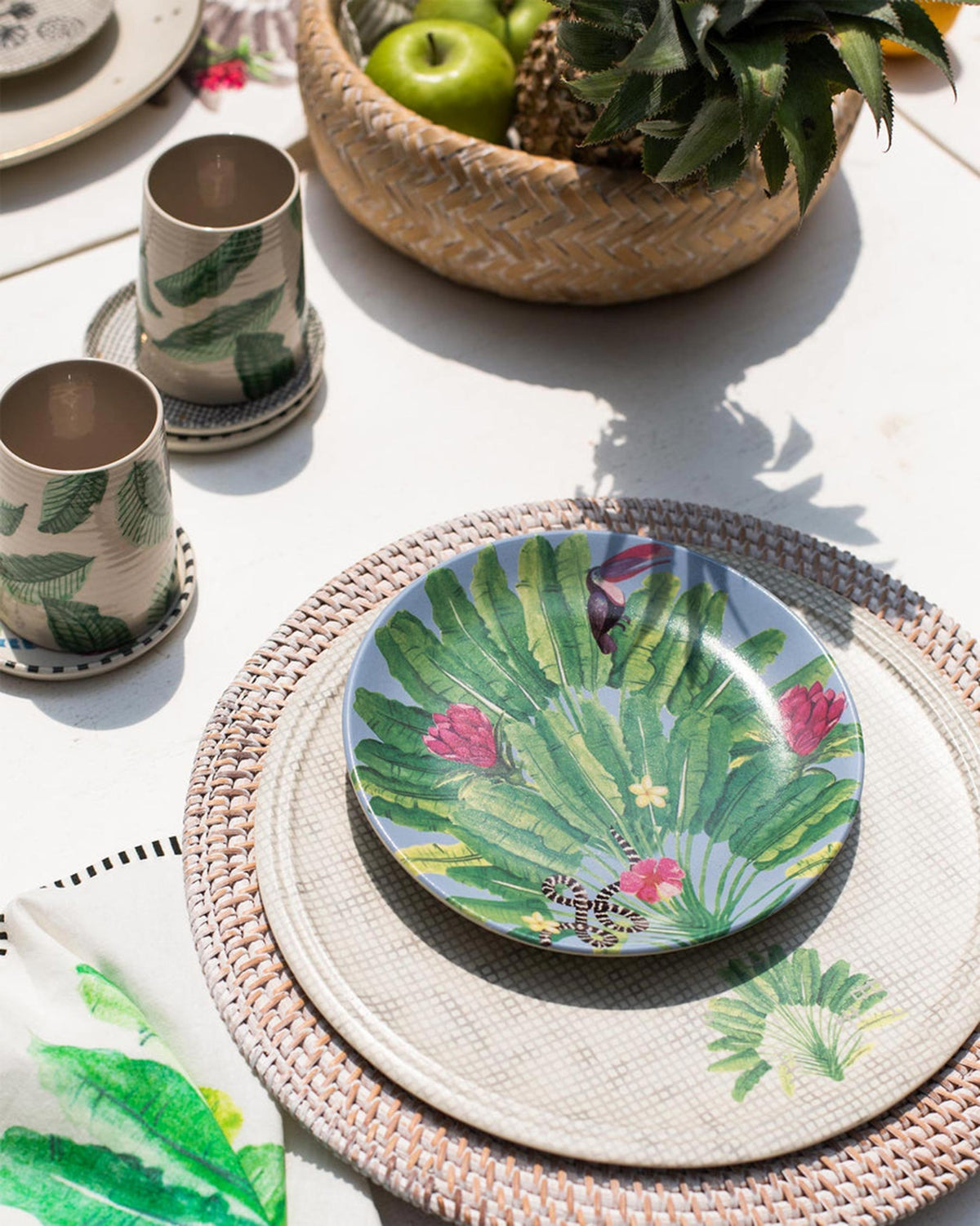 Madagascar quarter plate with toucan print styled on an outdoor table.
