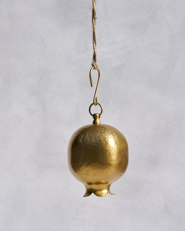 Hammered gold Anar bell shaped like a pomegranate on a hanging hook.